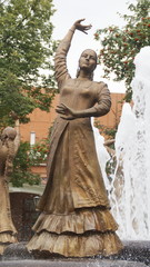 Photo of a statue of dancing woman in national costume at the fountain in Ufa, Bashkortostan