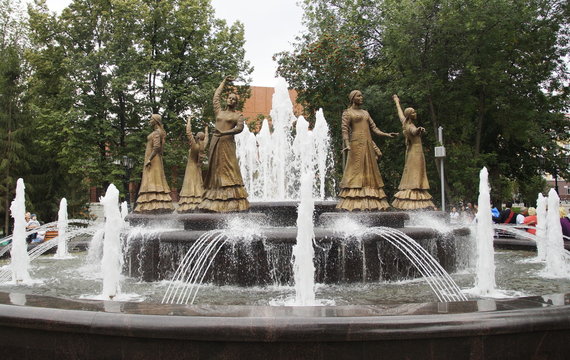 Photo of a statue of dancing woman in national costume at the fountain in Ufa, Bashkortostan