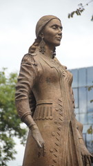 Photo of a statue of dancing woman in national costume at the fountain in Ufa, Bashkortostan