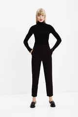 Fototapeta premium Confident young model in black, portrait