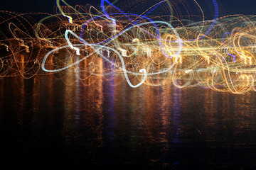 abstract colored waves of illumination in the reflection over th