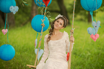 Portrait of a beautiful bride in white wedding dress smiling and
