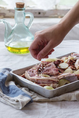 Raw lamb chops marinated