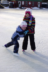 Fototapeta na wymiar Young Skaters on the Rideau Canal