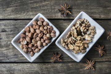 walnuts and hazelnuts on wooden table