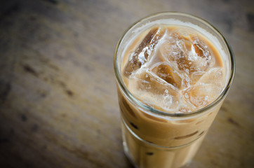Glass Of Cold Coffee On Wood Table
