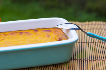 Squash pudding in ceramic tray close up