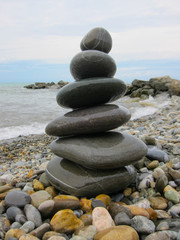 The pyramid of six  stones on the beach.