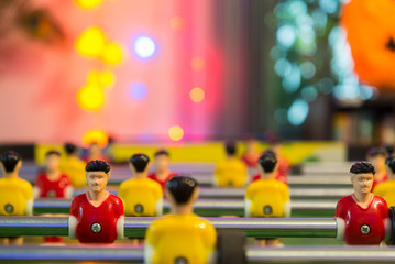 Soft shoot of dirty football table with warm light in background