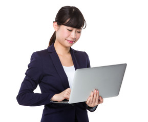 Asian Businesswoman use of the laptop computer