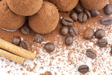 Chocolate truffles, cinnamon stick and coffee beans