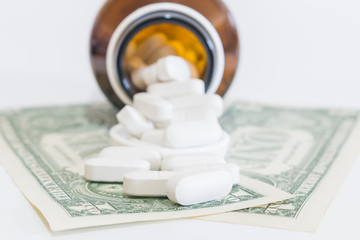 White Pills and Money on white background