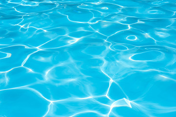 Fototapeta na wymiar Blue water rippled in swimming pool