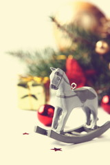 Christmas composition with wooden toy rocking horse