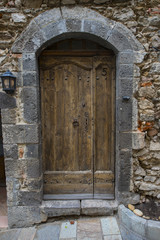 Fototapeta na wymiar Historic wooden doors in the village Grimaund - Grimaud - France, Departement Var, Côte d‘Azur