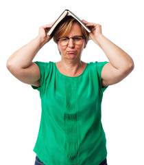 Fototapeta premium portrait of a mature woman tired of reading