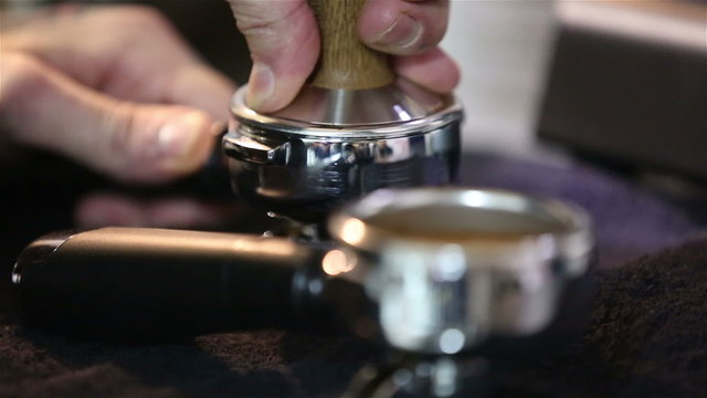 Barista makes coffee in the coffee machine. Sequence.