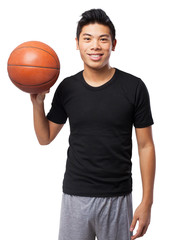 Obraz premium happy chinese sport man with basket ball