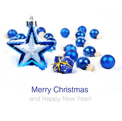 Colorful christmas decoration baubles on white with space for text
