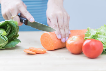 Salad preparation - cutting fresh vegetables into pieces
