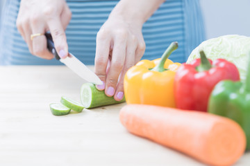 Salad preparation - cutting fresh vegetables into pieces