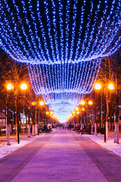 Festive Christmas New Year illuminations in city streets In Bela