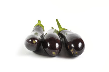 Three fresh aubergines isolated on white