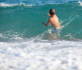 Little boy in the sea
