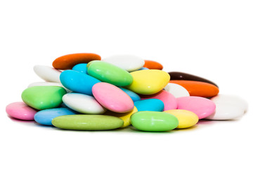 Obraz na płótnie Canvas candy covered with multicolored glaze on a white background