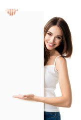 Brunette woman in casual clothing showing blank signboard