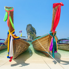 Longtail boats at the tropical beach of Poda island in Andaman s