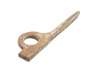 Old climbing piton isolated on white background