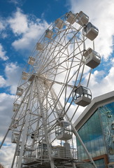 Attraction wheel on the city waterfront