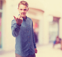happy young-man insult sign