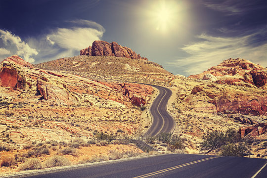Retro stylized picture of a country road, travel concept, USA.