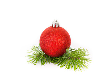 Red Christmas ornament with fir on white background