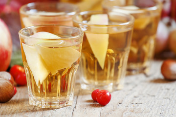 Apple cider in the autumn background, selective focus