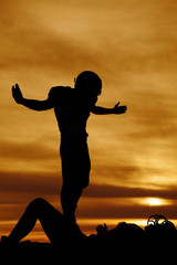 silhouette of a football player after a tackle