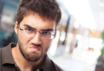 portrait of angry man over abstract background