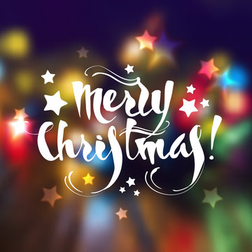 Christmas greeting card with lettering and blurring background