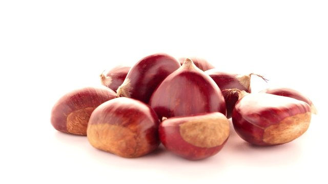 Chestnuts with shell isolated on white background.