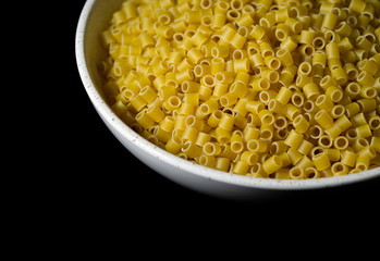 Ditalini pasta in a shallow bowl