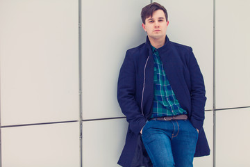 Young urban businessman in street