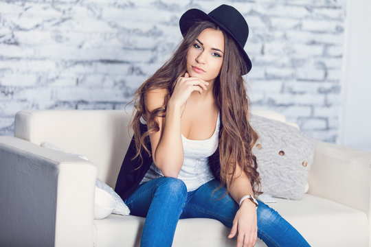Beautiful hipster girl on a couch