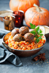 Lentils with vegetables, pumpkin and lamb meatballs, selective focus