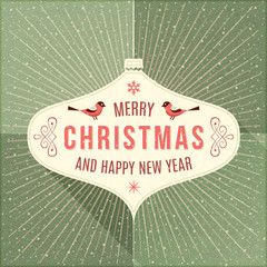 Beige Label with Christmas Greeting Hanging in Front of a Green