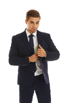 Business man hiding money in jacket isolated on white