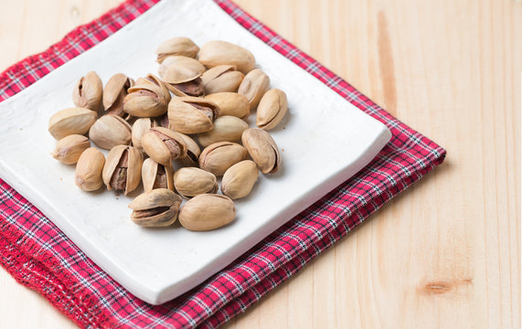 pistachio nut on wood background