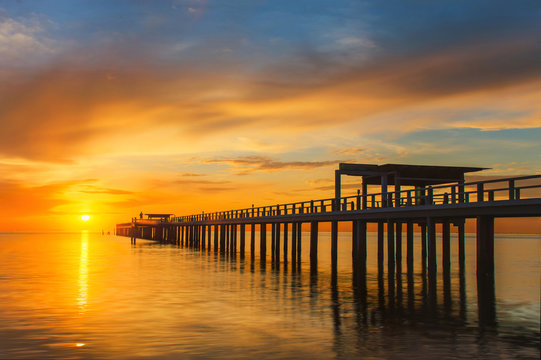 Fototapeta Summer, Travel, Vacation and Holiday concept - Wooden pier betwe