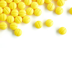 Small medicine tablets (or pills) on white background